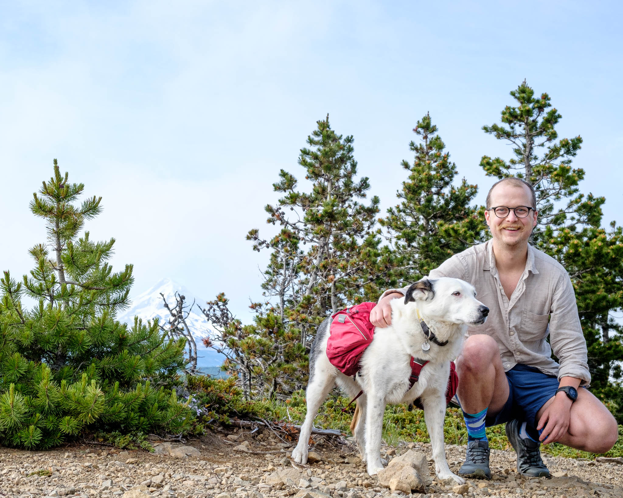 A photo of the author, Kevin, and his dog Reef posing in front of Wy'East.